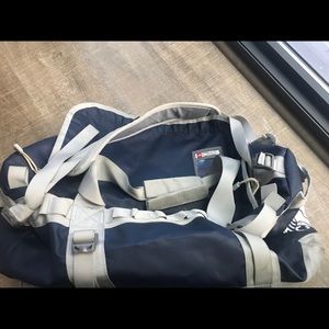 A small and a large North-face duffel bag